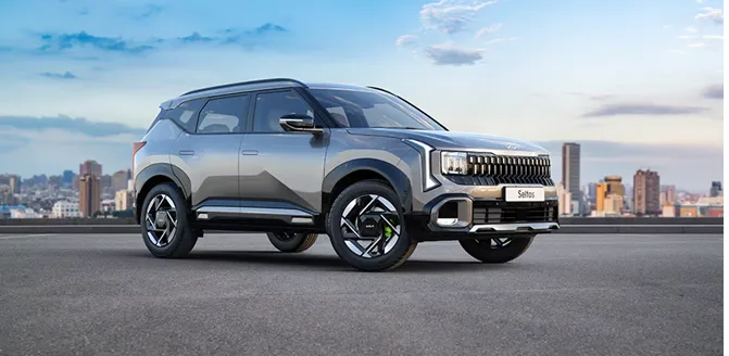 White 2026 Kia Seltos parked in a modern dealership showroom with premium lighting and clean interior design